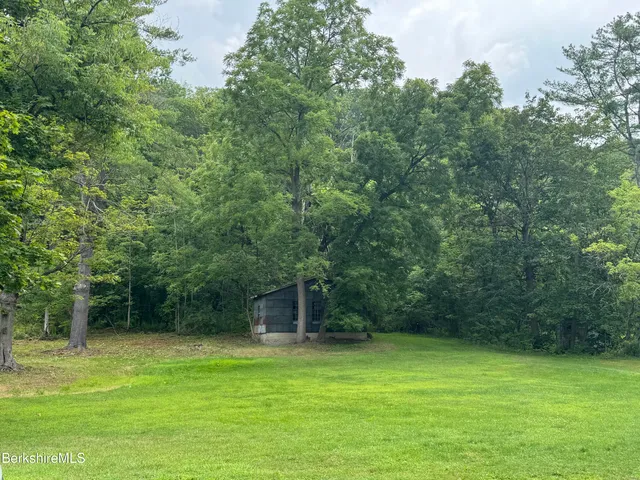 a fire hydrant in the middle of a field