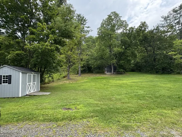 a view of a backyard with a garden