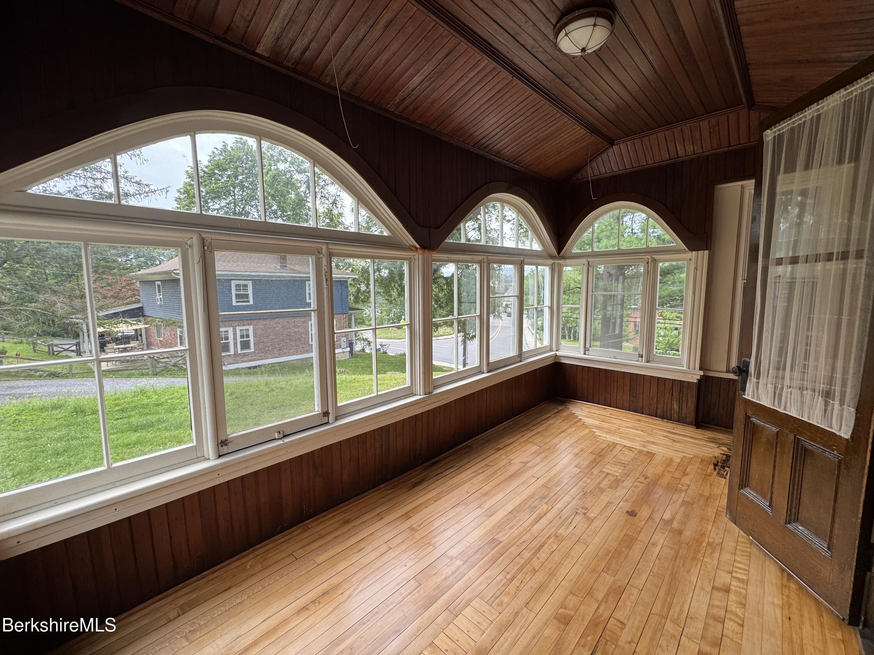 672-676 North Hoosac Road Williamstown, MA 01267 - Photo 8 of 14 a view of an empty room with a window and wooden floor