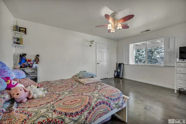 a bathroom with a double vanity sink mirror and toilet