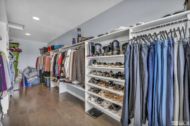 a view of a balcony with wooden floor and fence
