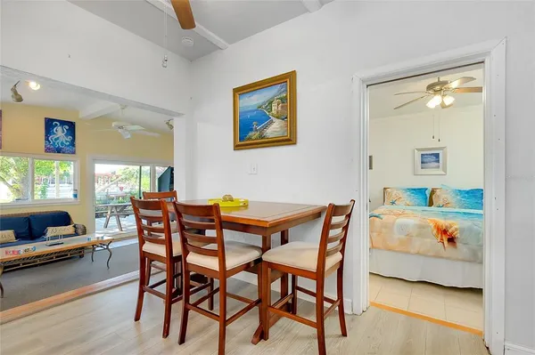 a kitchen with stainless steel appliances granite countertop a sink cabinets and wooden floor
