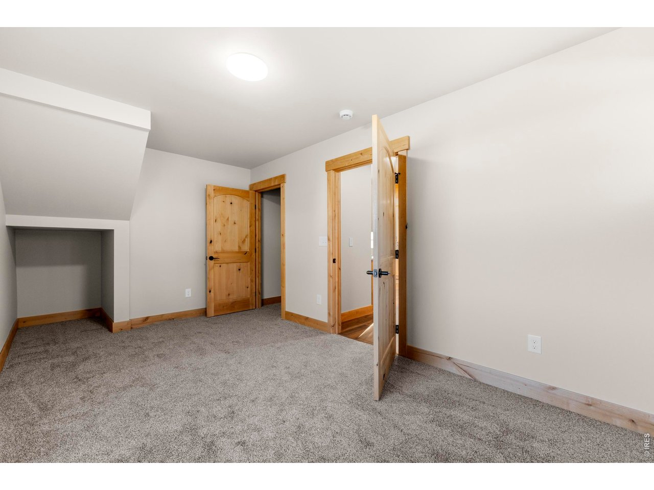 1074 Caddo Road Red Feather Lakes, CO 80545 - Photo 15 of 34 Main Level Primary Bedroom