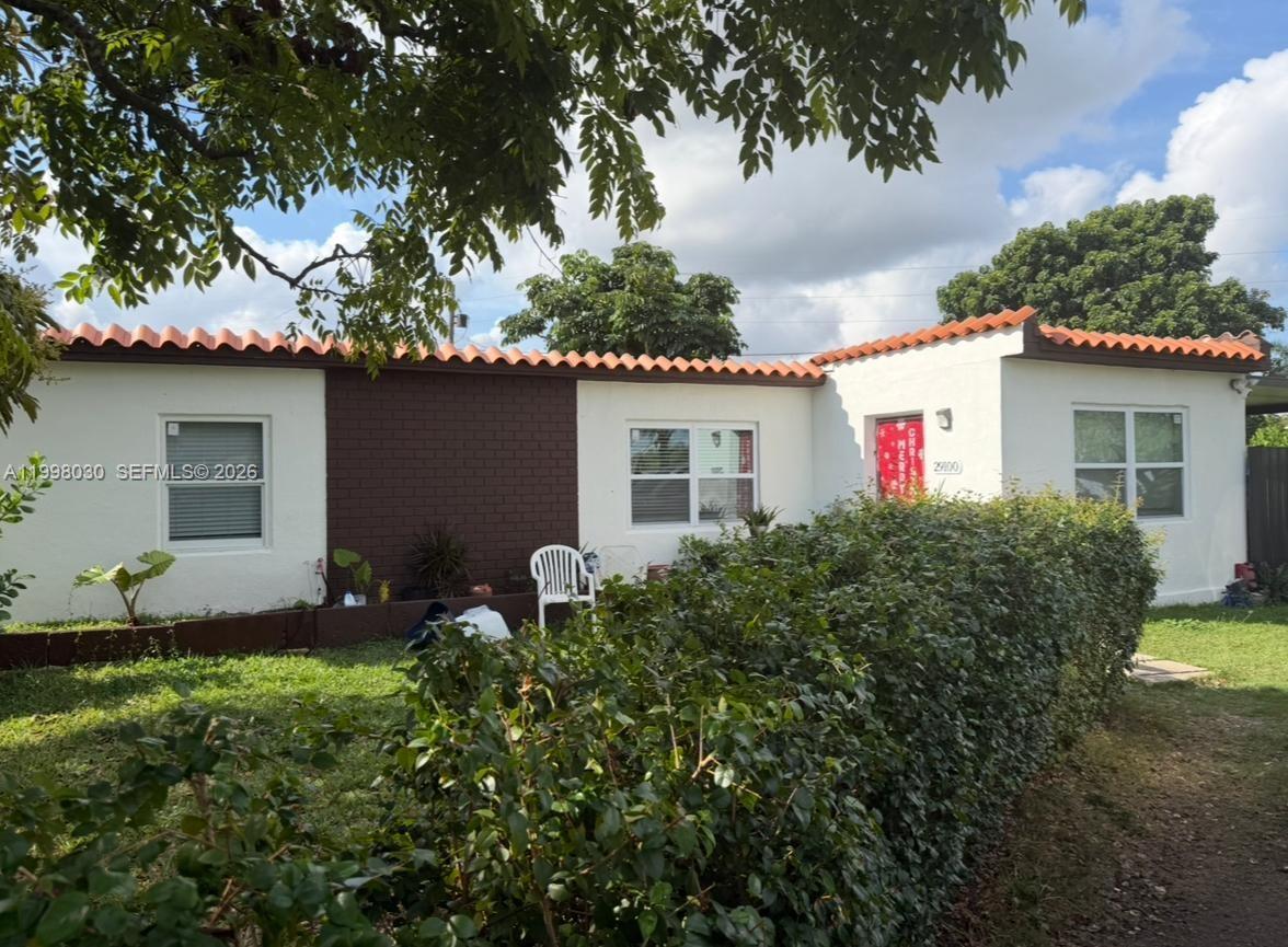a house view with a garden space