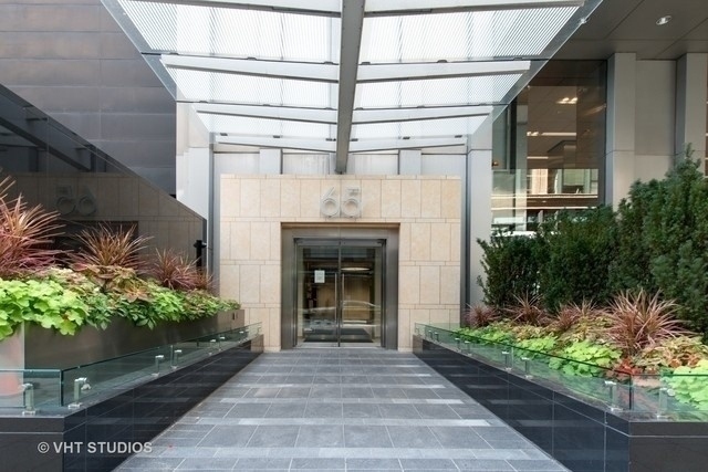 65 East Monroe Street, Unit 4521 Chicago, IL 60603 - Photo 1 of 25 a front view of a house with potted plants