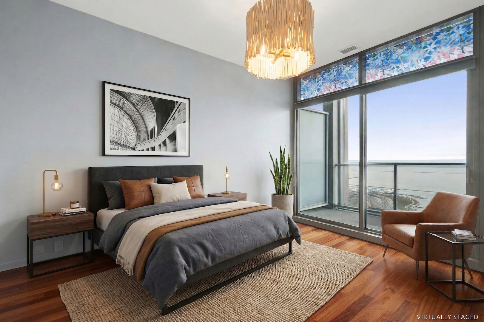 65 East Monroe Street, Unit 4521 Chicago, IL 60603 - Photo 6 of 25 a bedroom with a bed and a chandelier