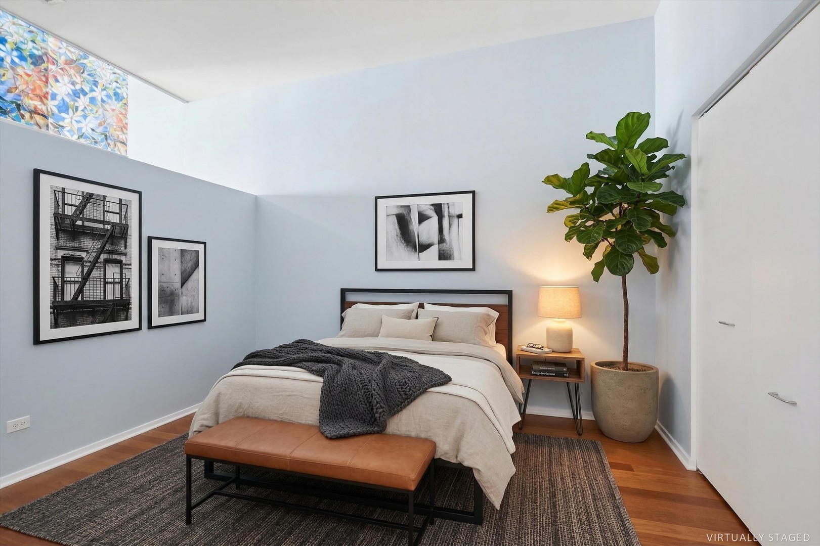 65 East Monroe Street, Unit 4521 Chicago, IL 60603 - Photo 9 of 25 a bedroom with a bed a couch and potted plant