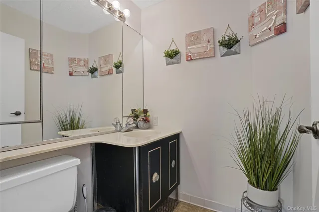 a bathroom with a sink a toilet and a bathtub