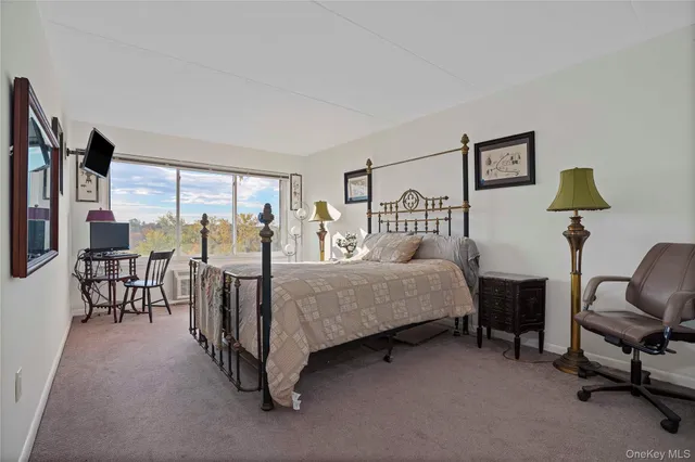 a kitchen that has a lot of cabinets a sink and appliances