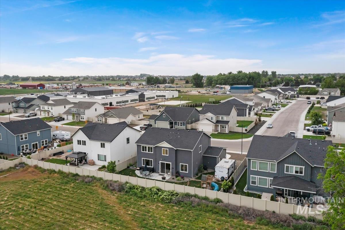 815 Knowledge Street Middleton, ID 83644 - Photo 48 of 49 Aerial perspective of a residential community featuring multiple two-story homes with dark shingle roofs and varied siding colors