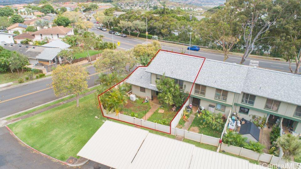 a view of a yard with an outdoor seating