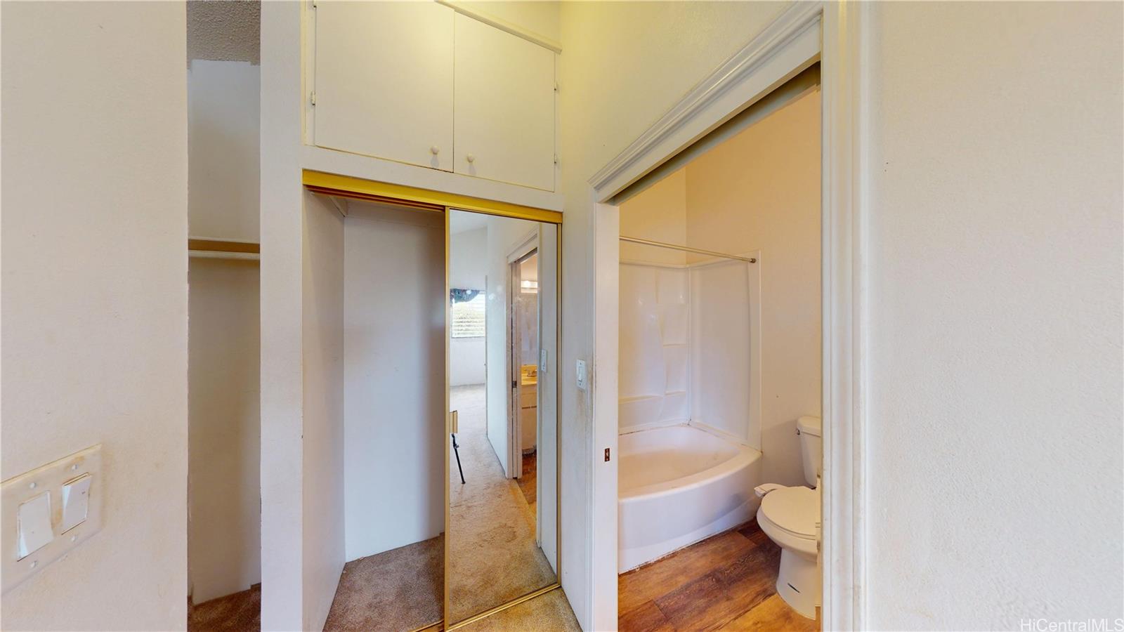 92-1244 Kikaha Street, Unit 14 Kapolei, HI 96707 - Photo 12 of 25 a bathroom with a toilet and a shower