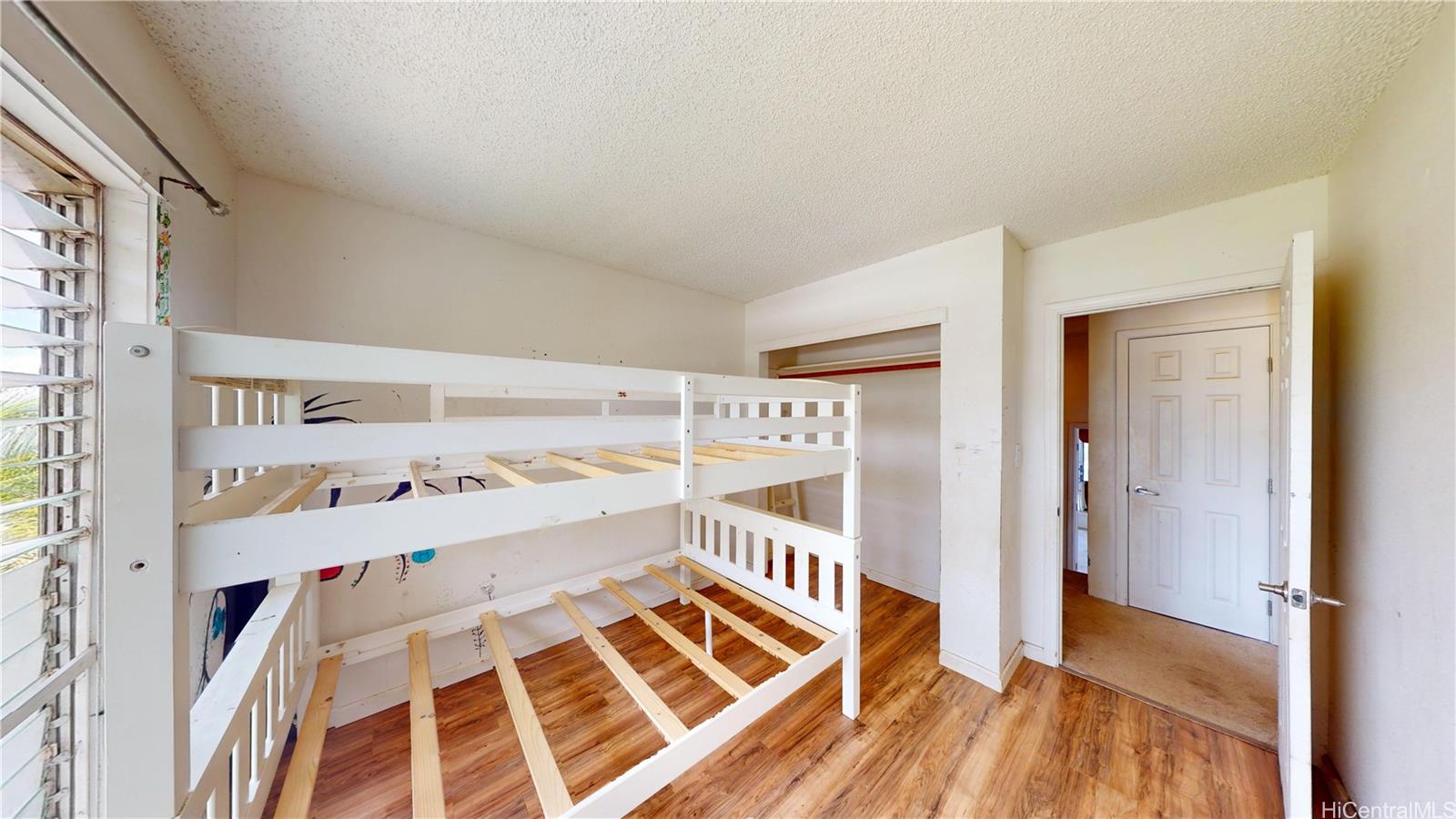 92-1244 Kikaha Street, Unit 14 Kapolei, HI 96707 - Photo 15 of 25 a walk in closet with wooden floor