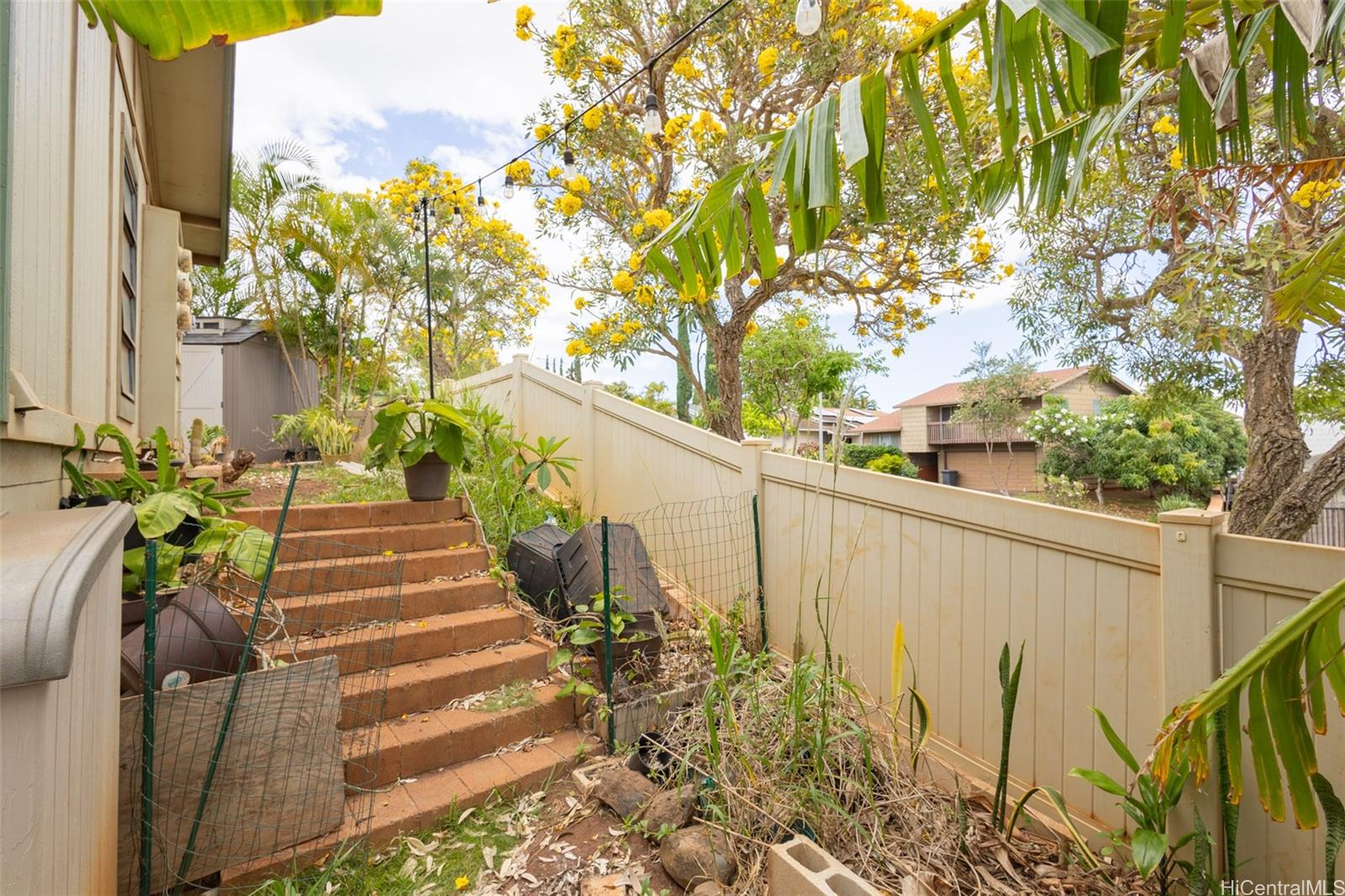 92-1244 Kikaha Street, Unit 14 Kapolei, HI 96707 - Photo 18 of 25 a view of a pathway of a building