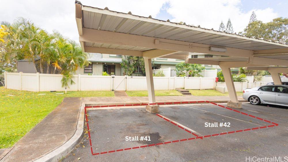 92-1244 Kikaha Street, Unit 14 Kapolei, HI 96707 - Photo 21 of 25 a view of a patio with a table and chairs