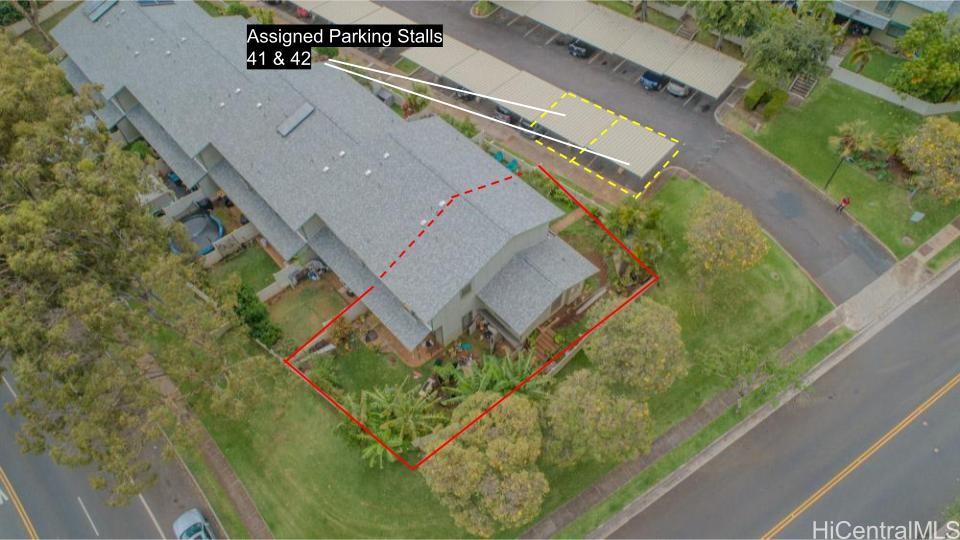 92-1244 Kikaha Street, Unit 14 Kapolei, HI 96707 - Photo 24 of 25 a view of a swimming pool with a yard