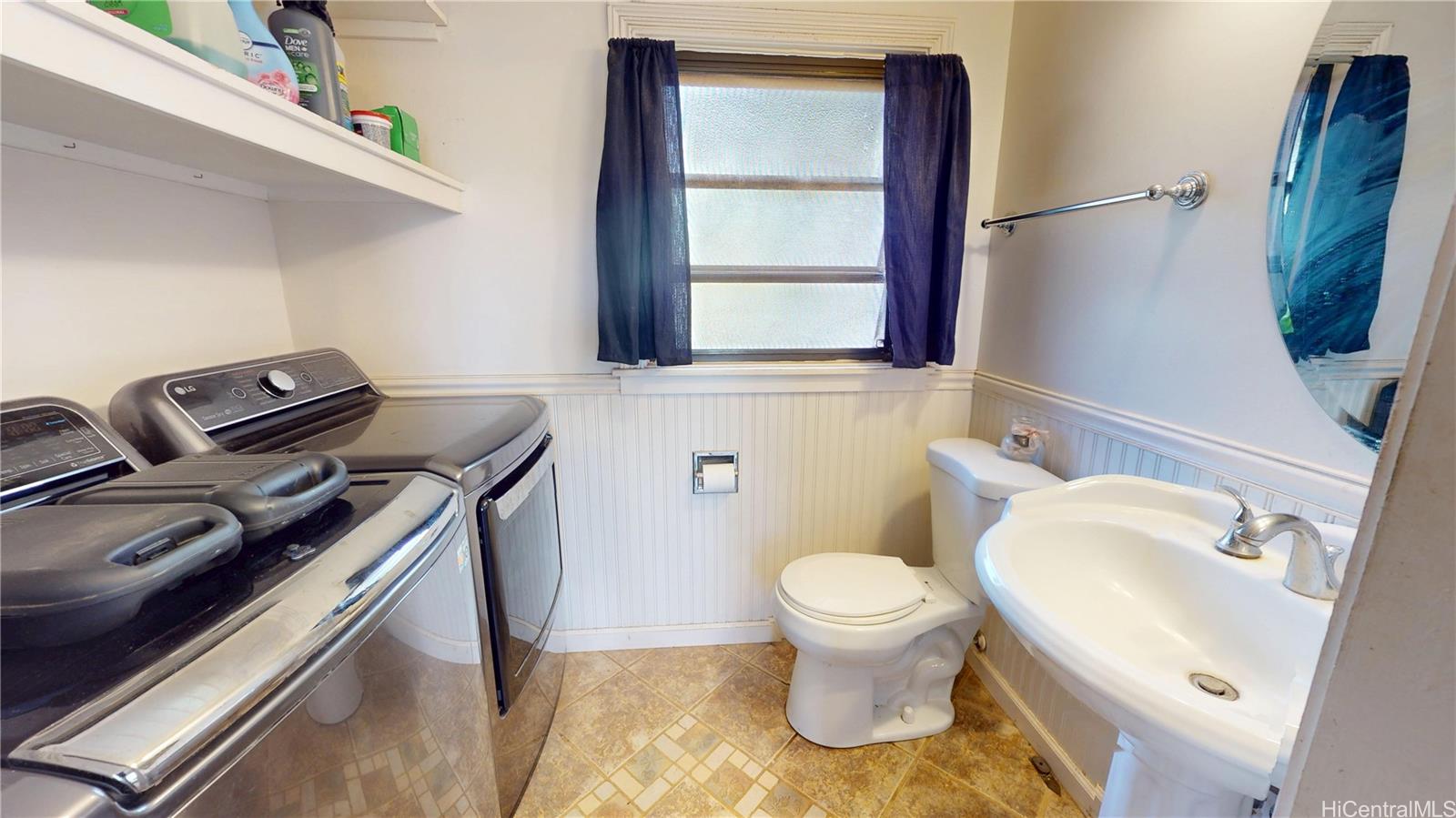 92-1244 Kikaha Street, Unit 14 Kapolei, HI 96707 - Photo 8 of 25 a bathroom with a sink and a toilet