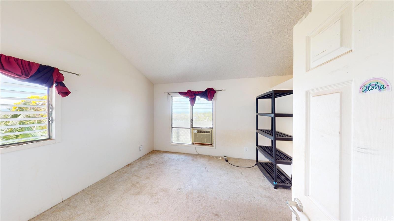 92-1244 Kikaha Street, Unit 14 Kapolei, HI 96707 - Photo 10 of 25 an empty room with windows and closet