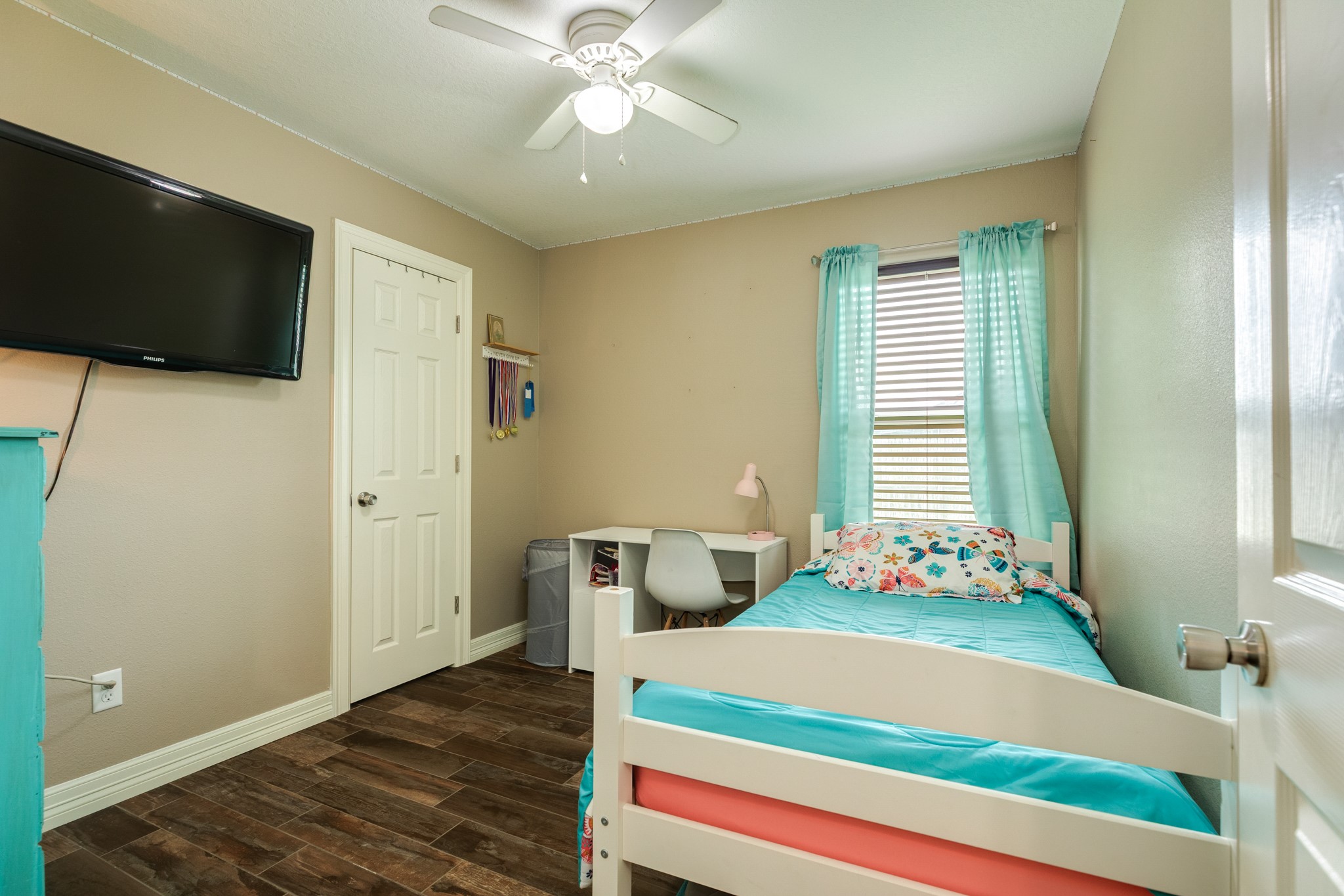 6108 Fox Ridge Drive Angleton, TX 77515 - Photo 19 of 26 a bedroom with a bed and a flat screen tv