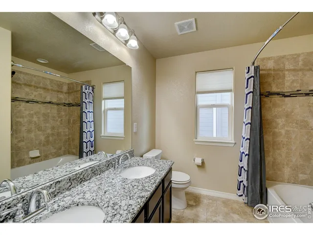 a room with furniture and a potted plant