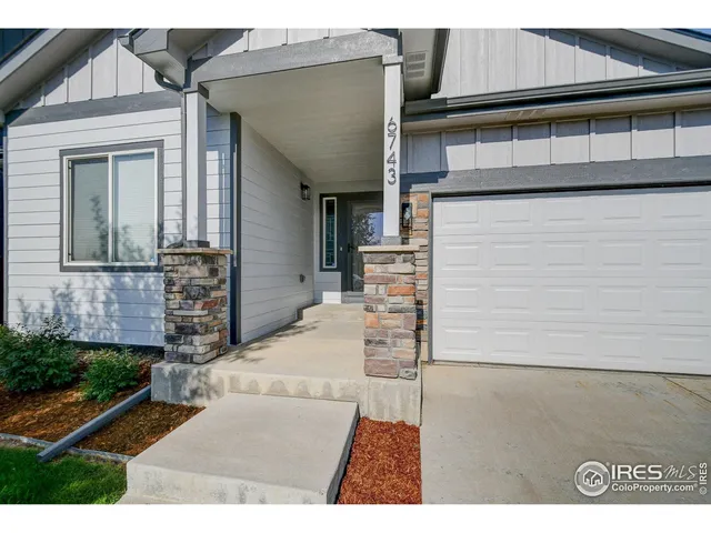 a view of a house with a street