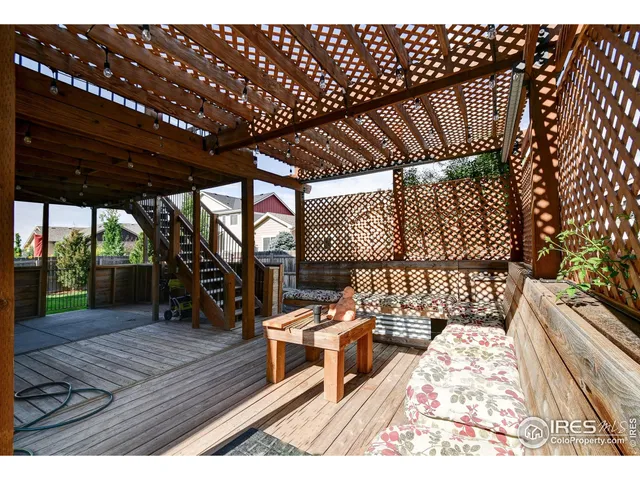 a view of a patio with a table and chairs