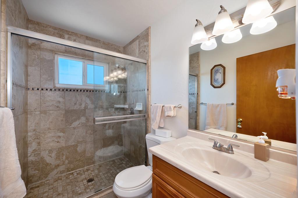 1333 Wesley Lane Auburn, CA 95603 - Photo 18 of 35 a bathroom with a sink vanity granite toilet and shower