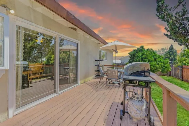 a view of balcony with furniture and wooden deck
