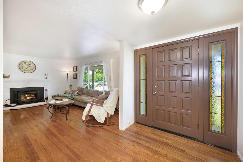 1333 Wesley Lane Auburn, CA 95603 - Photo 7 of 35 a living room with furniture and a fireplace