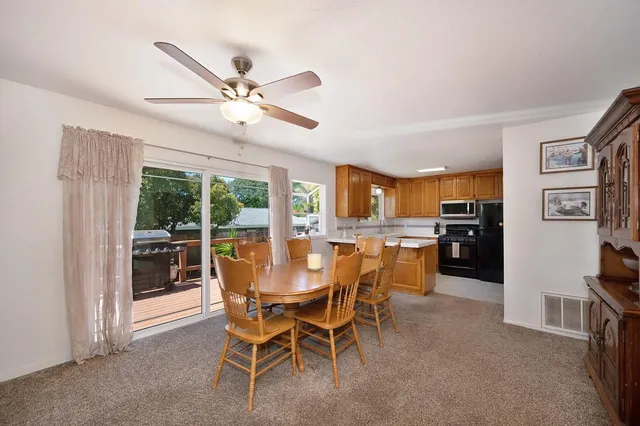 a dining room with furniture and window