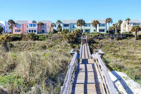 a swimming pool with outdoor seating and yard