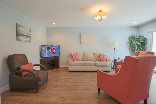 a view of a chairs and table in a balcony