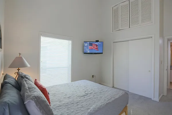 a bedroom with a bed and a table