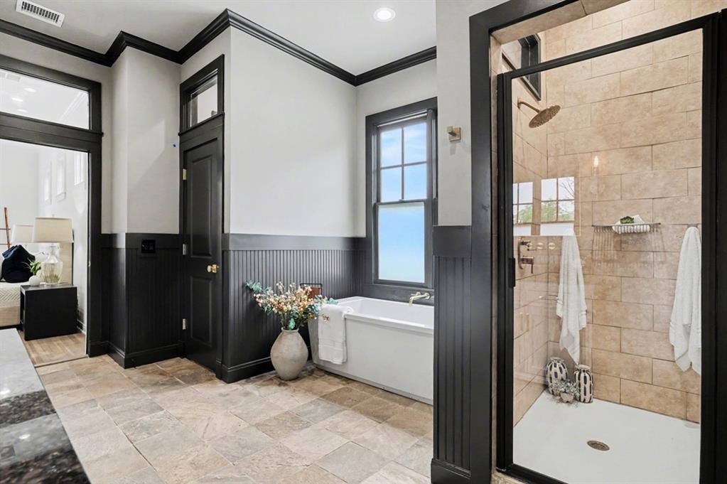 3923 Ranch Estates Circle Plano, TX 75074 - Photo 15 of 32 a bathroom with a bathtub and a shower