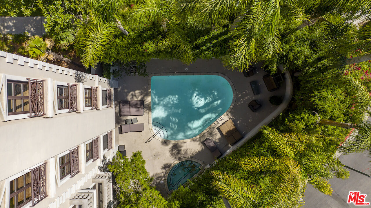 425 North Maple Drive, Unit PH 602 Beverly Hills, CA 90210 - Photo 20 of 37 a view of a house with a yard