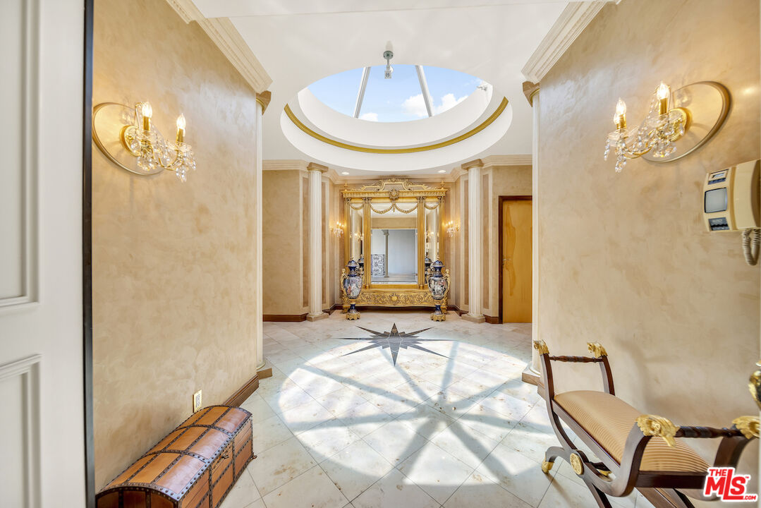 425 North Maple Drive, Unit PH 602 Beverly Hills, CA 90210 - Photo 2 of 37 a view of a livingroom with furniture and window