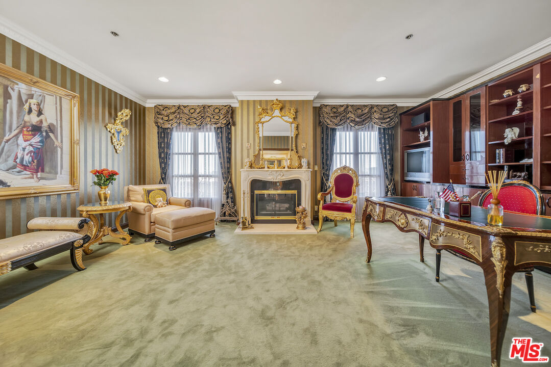 425 North Maple Drive, Unit PH 602 Beverly Hills, CA 90210 - Photo 29 of 37 a living room with furniture and a flat screen tv