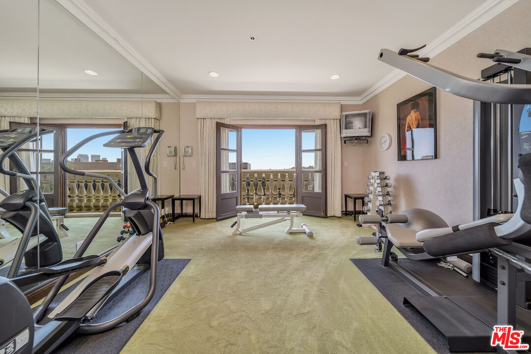425 North Maple Drive, Unit PH 602 Beverly Hills, CA 90210 - Photo 32 of 37 a view of a room with gym equipment