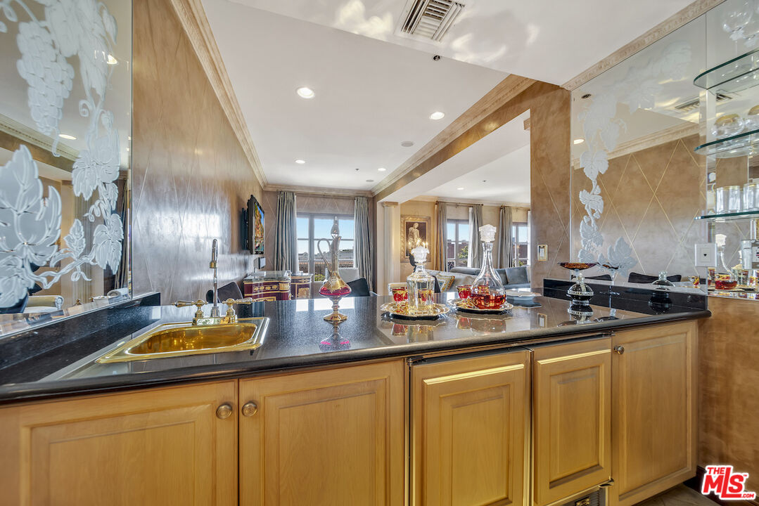 425 North Maple Drive, Unit PH 602 Beverly Hills, CA 90210 - Photo 7 of 37 a kitchen with sink and lots of counter space