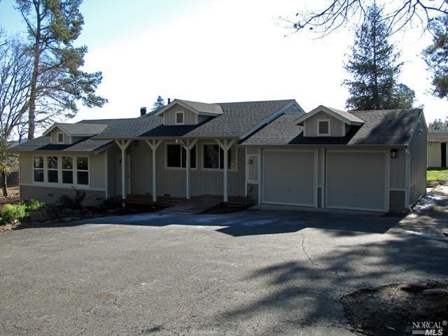 9689 Oconnell Road Sebastopol, CA 95472 - Photo 1 of 1 a front view of a house with a garden
