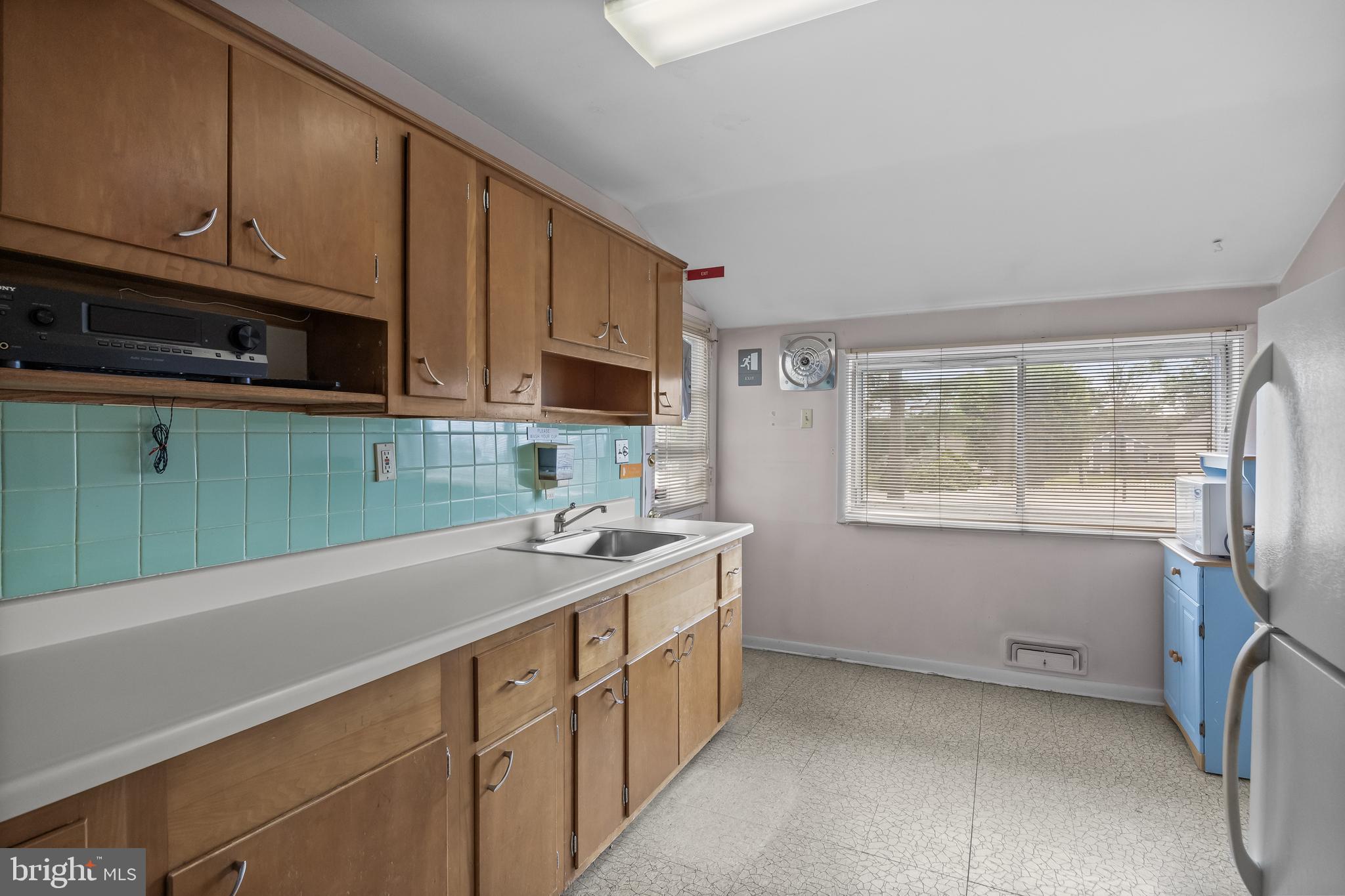 64 Warwick Road Stratford, NJ 08084 - Photo 15 of 28 a kitchen with a sink cabinets and window