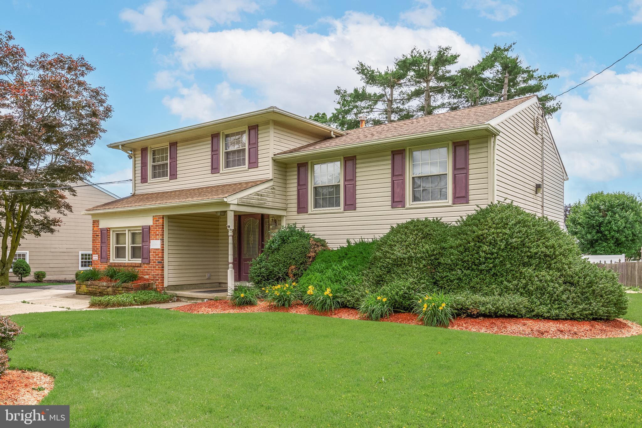 64 Warwick Road Stratford, NJ 08084 - Photo 2 of 28 a front view of house with yard and green space
