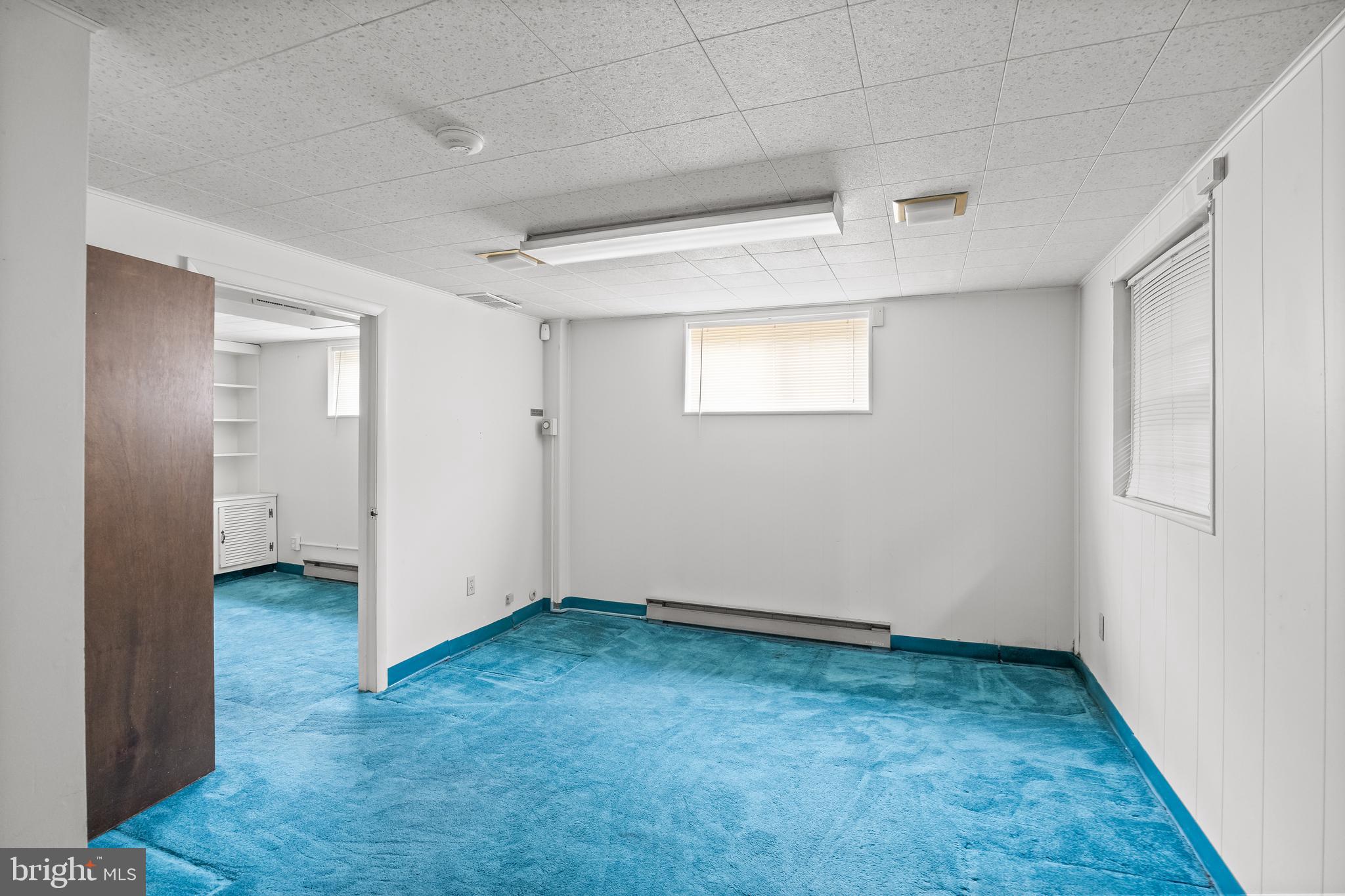 64 Warwick Road Stratford, NJ 08084 - Photo 25 of 28 an empty room with a empty space and windows