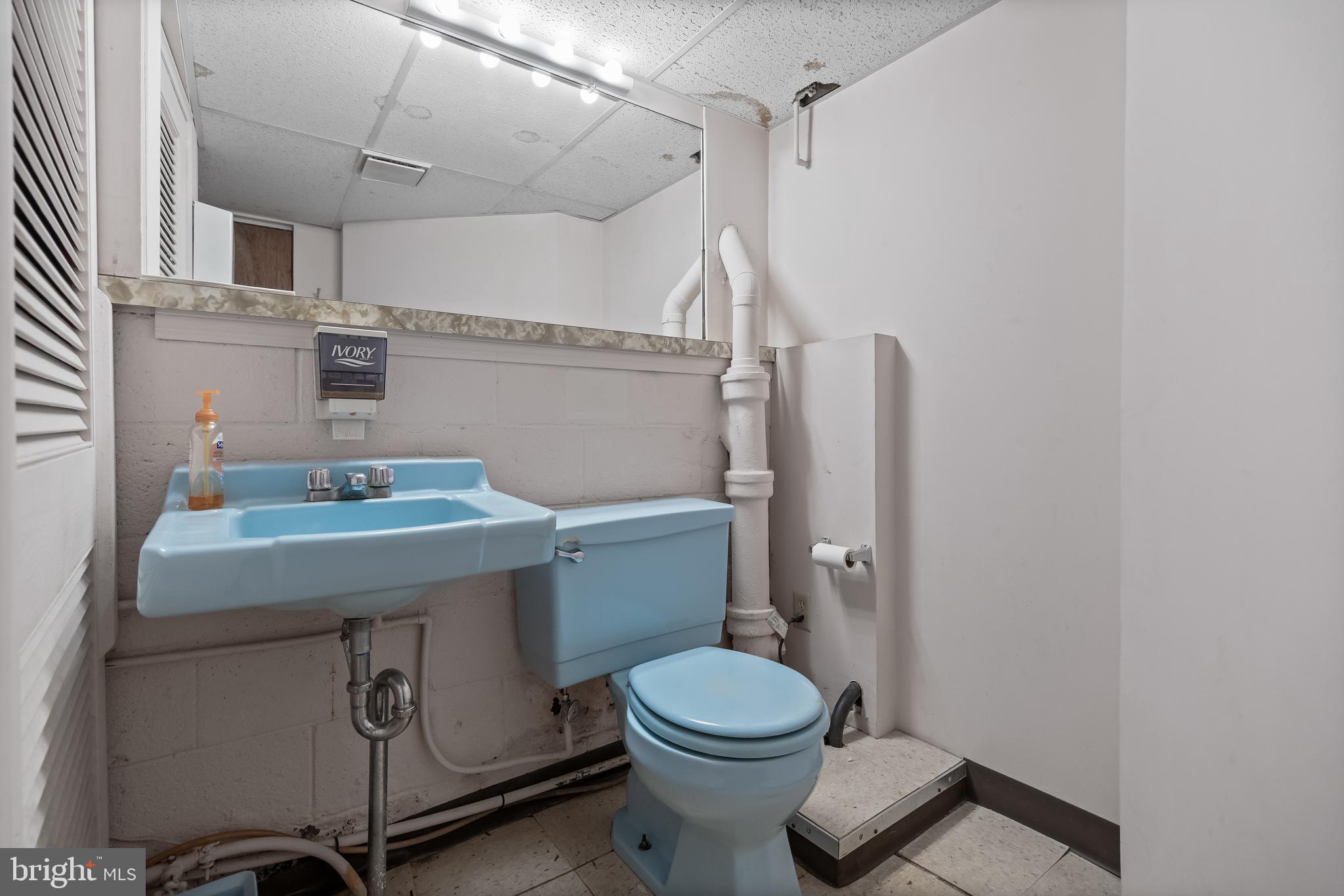 64 Warwick Road Stratford, NJ 08084 - Photo 26 of 28 a bathroom with a sink a toilet and shower