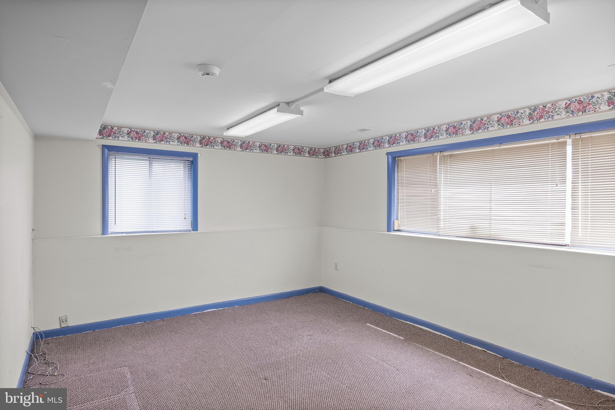 64 Warwick Road Stratford, NJ 08084 - Photo 9 of 28 a view of an empty room with a window