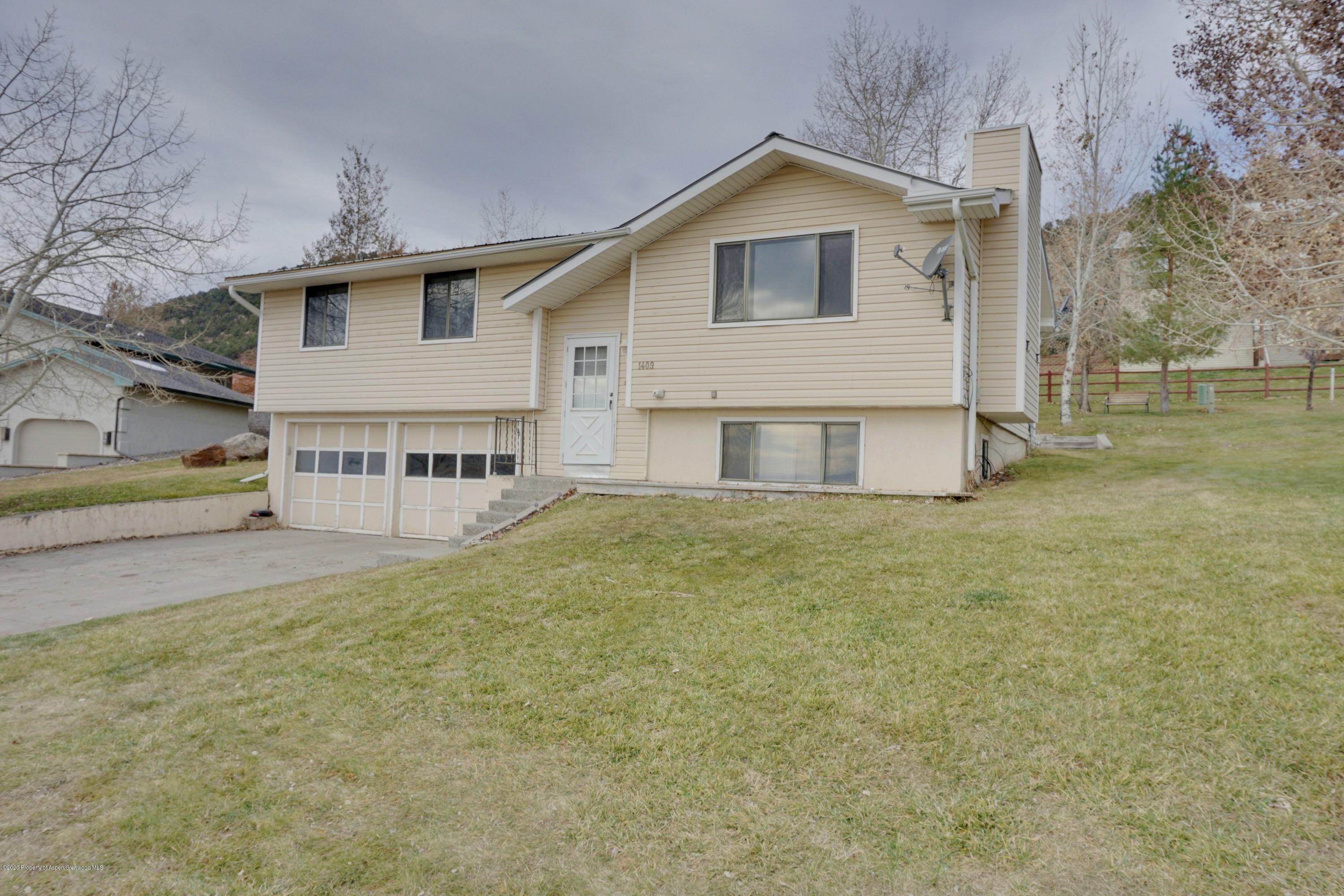 1409 Silver Sage Road Meeker, CO 81641 - Photo 1 of 26 a view of a house with a yard and sitting area
