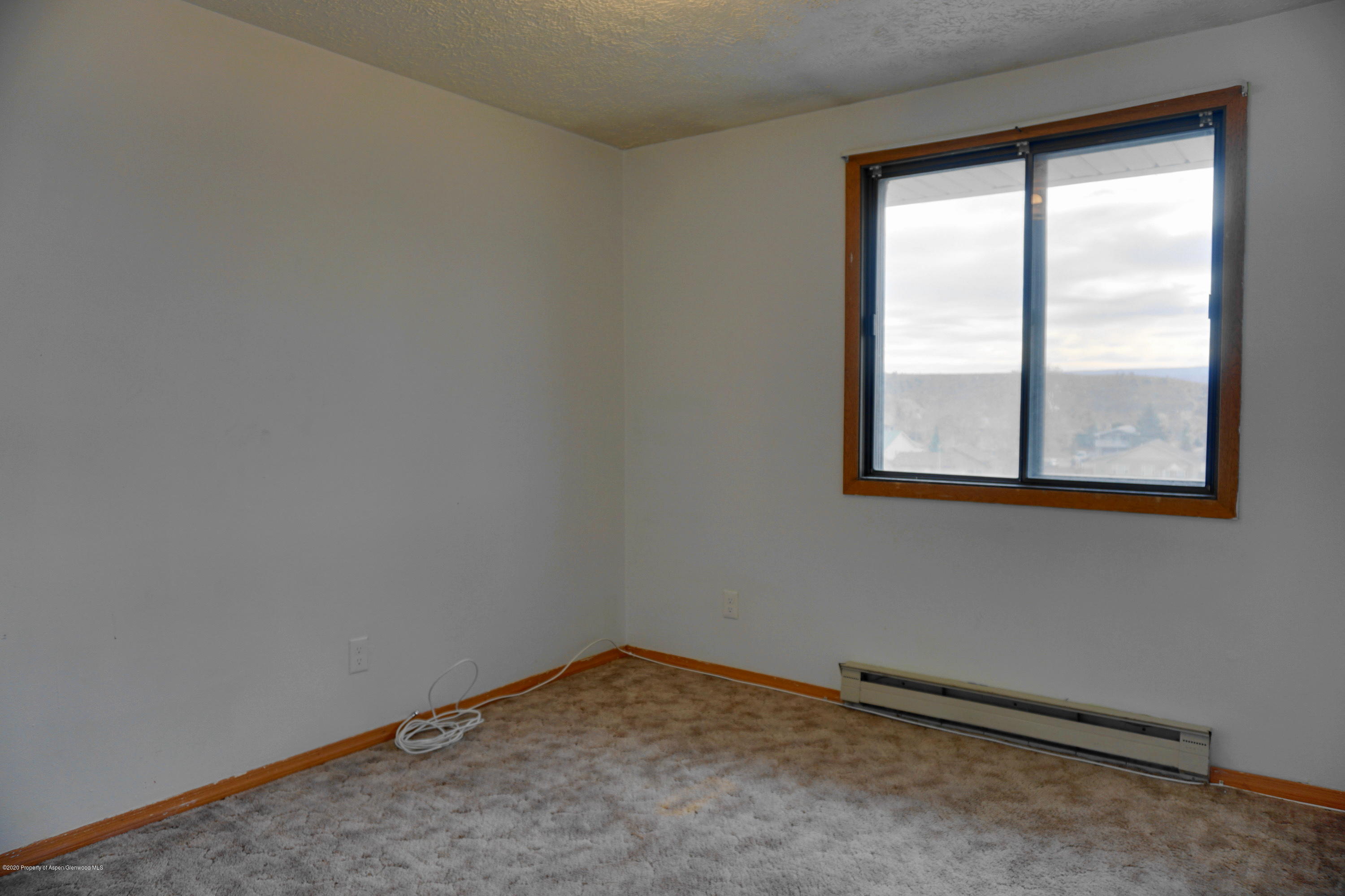 1409 Silver Sage Road Meeker, CO 81641 - Photo 11 of 26 an empty room with a window