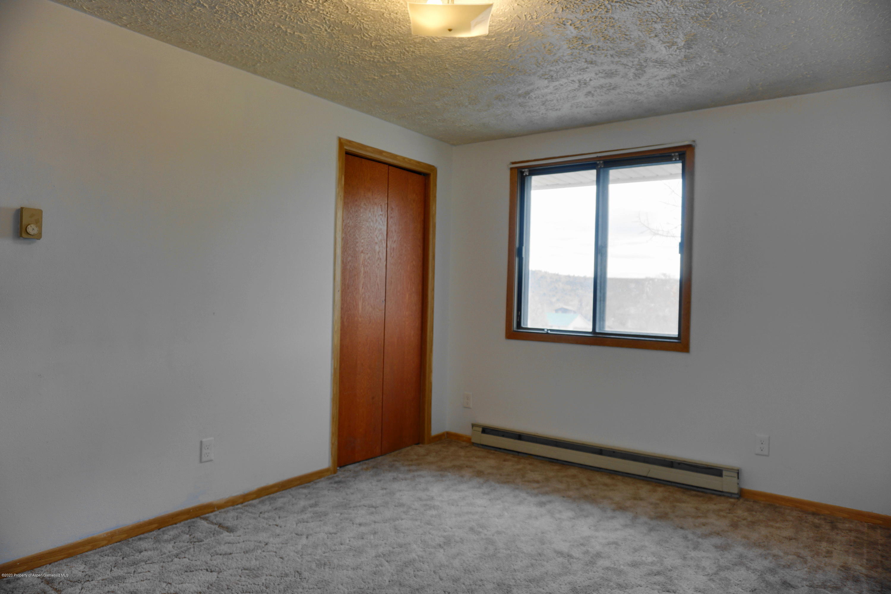1409 Silver Sage Road Meeker, CO 81641 - Photo 12 of 26 an empty room with a window