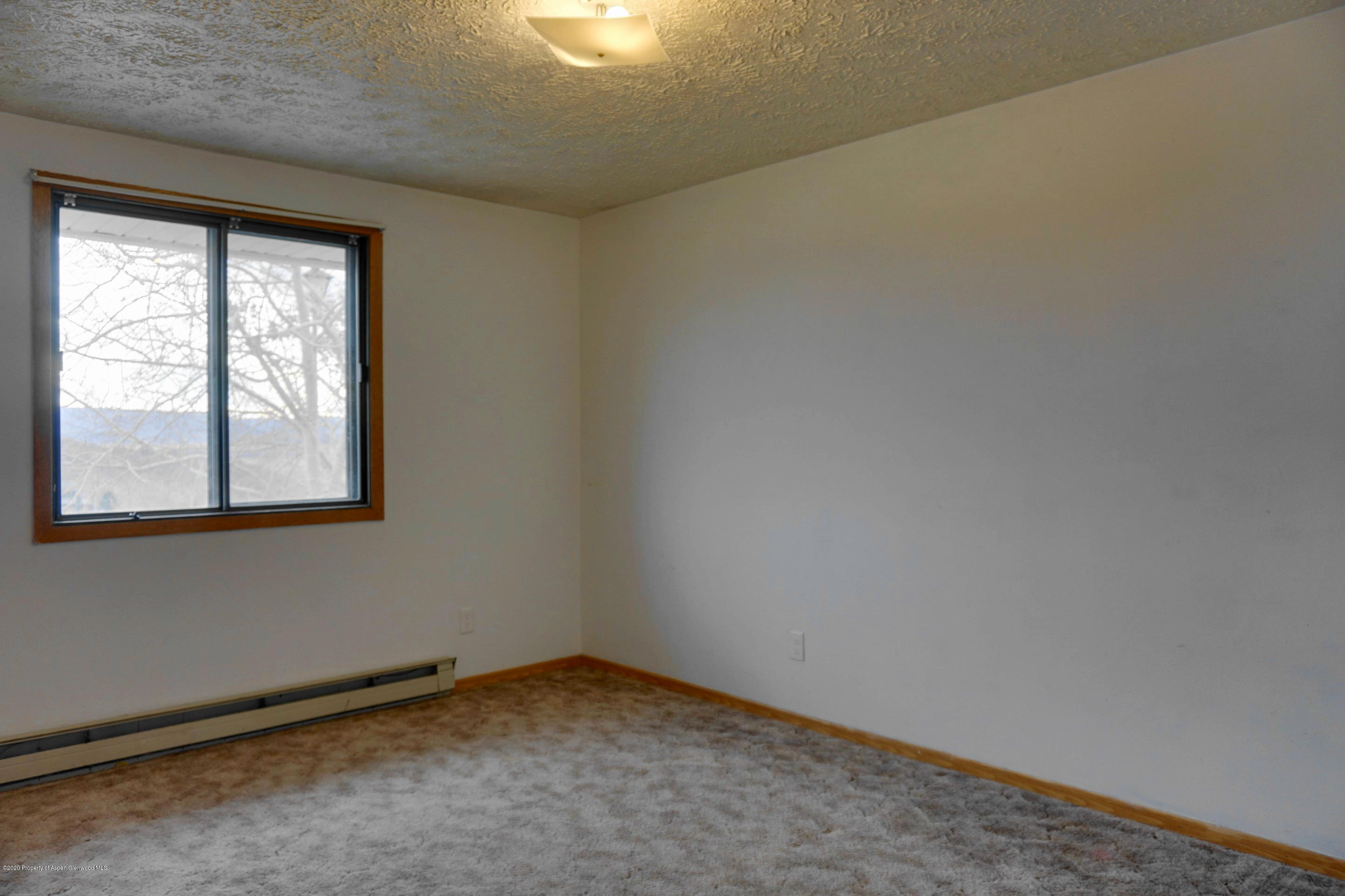 1409 Silver Sage Road Meeker, CO 81641 - Photo 13 of 26 an empty room with a window