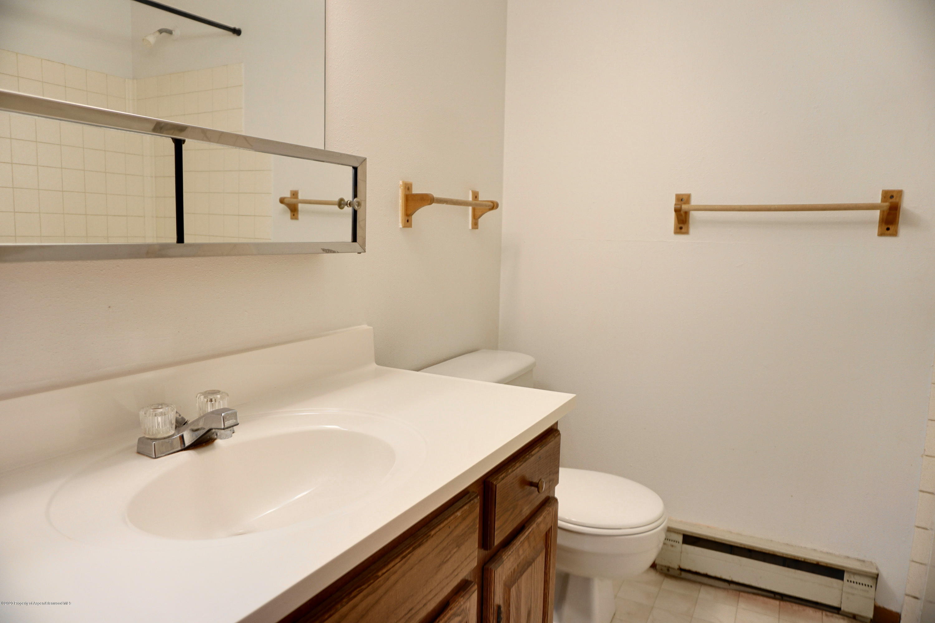 1409 Silver Sage Road Meeker, CO 81641 - Photo 14 of 26 a bathroom with a sink toilet and vanity